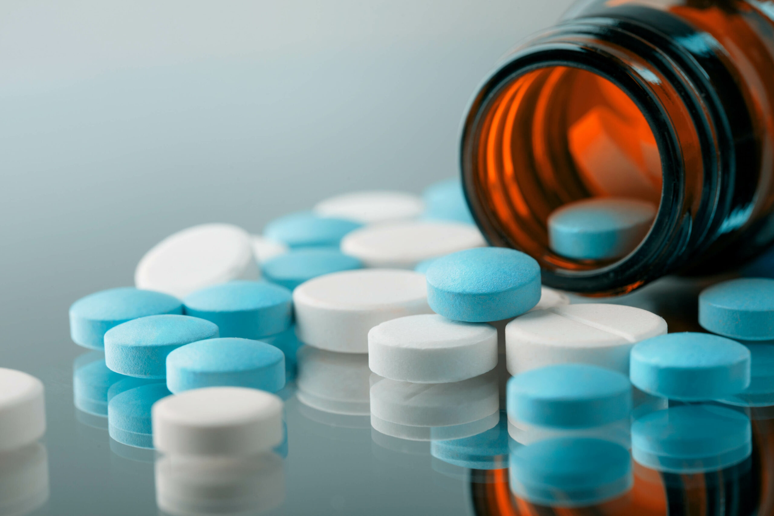 Medication round pills, close-up view Manufacturing Supplements in Blister Packs